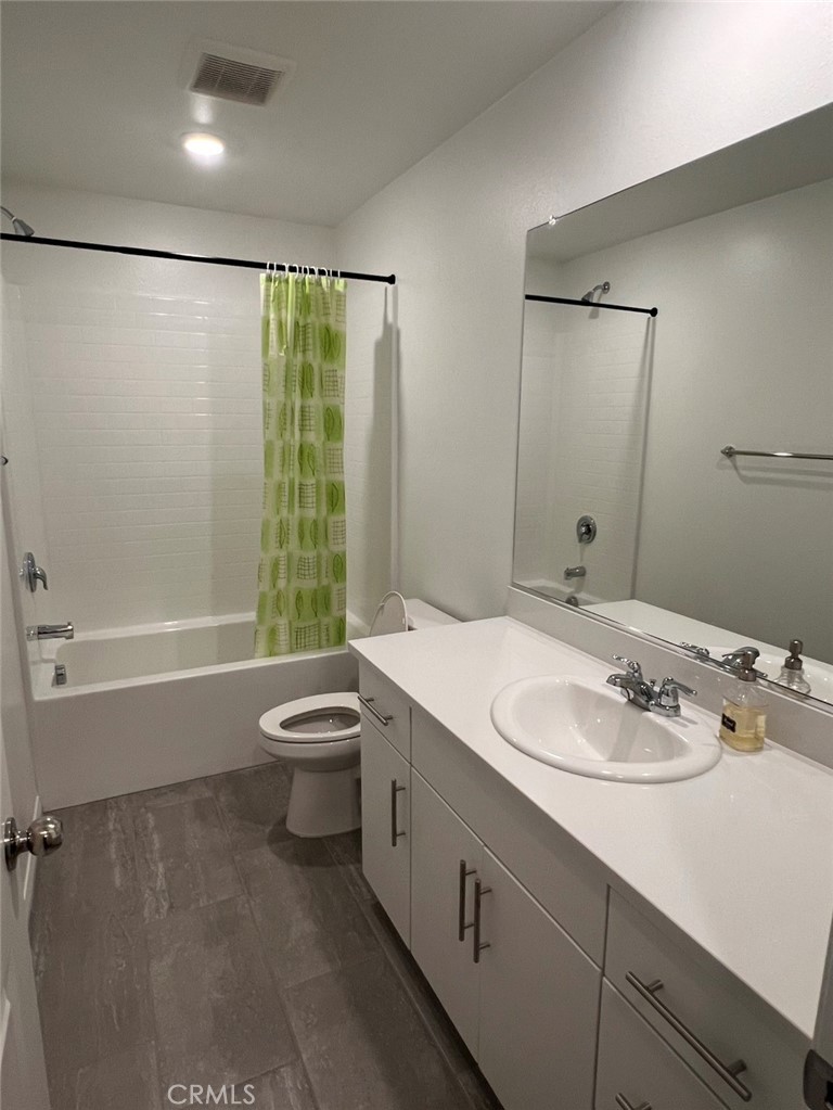 7440 Fig Grv Lane Riverside, CA 92507 - Photo 4 of 5 a bathroom with a granite countertop sink toilet and shower