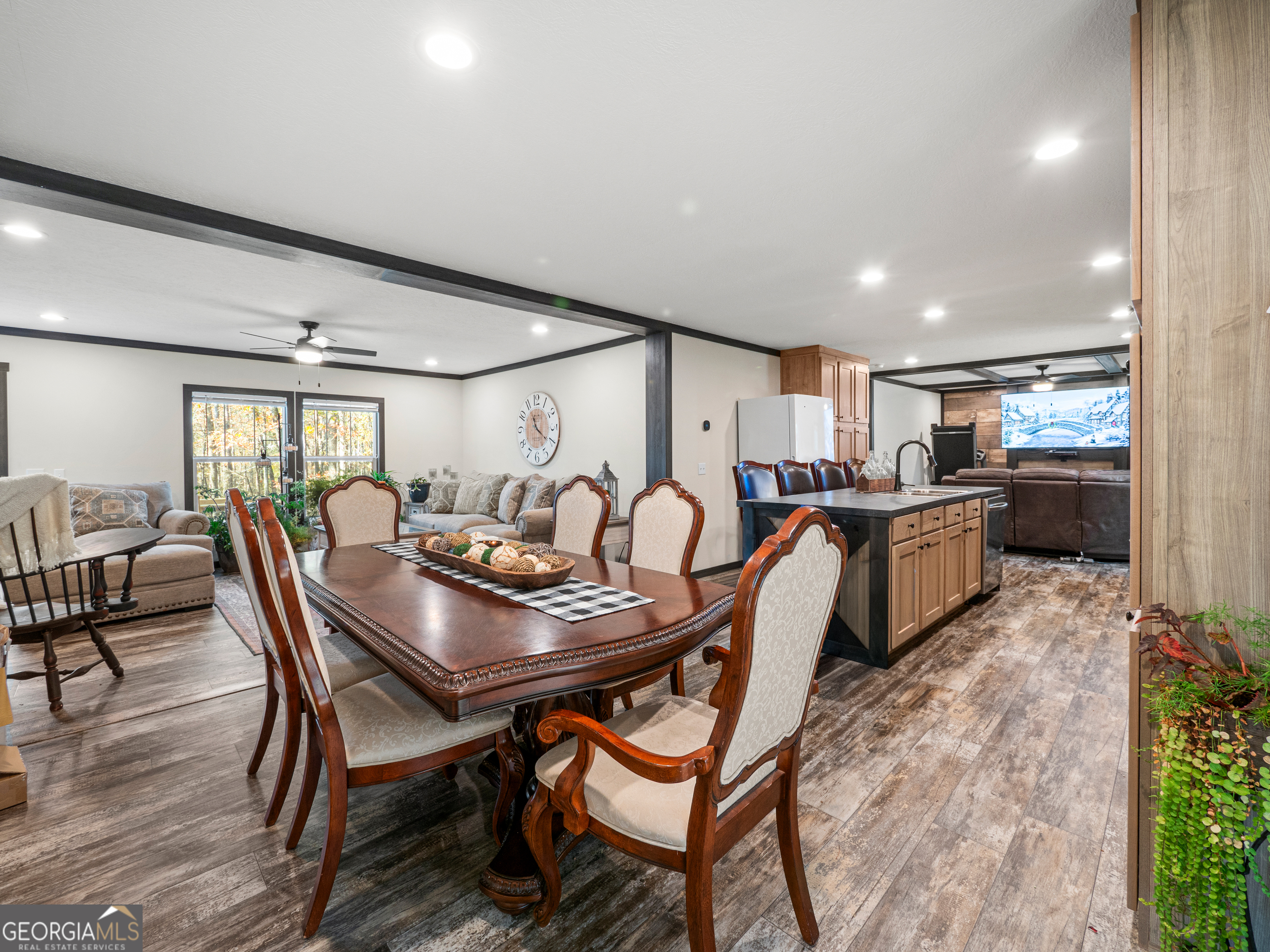 163 M M T Trail Commerce, GA 30530 - Photo 12 of 32 a kitchen with stainless steel appliances kitchen island granite countertop a table chairs and a refrigerator