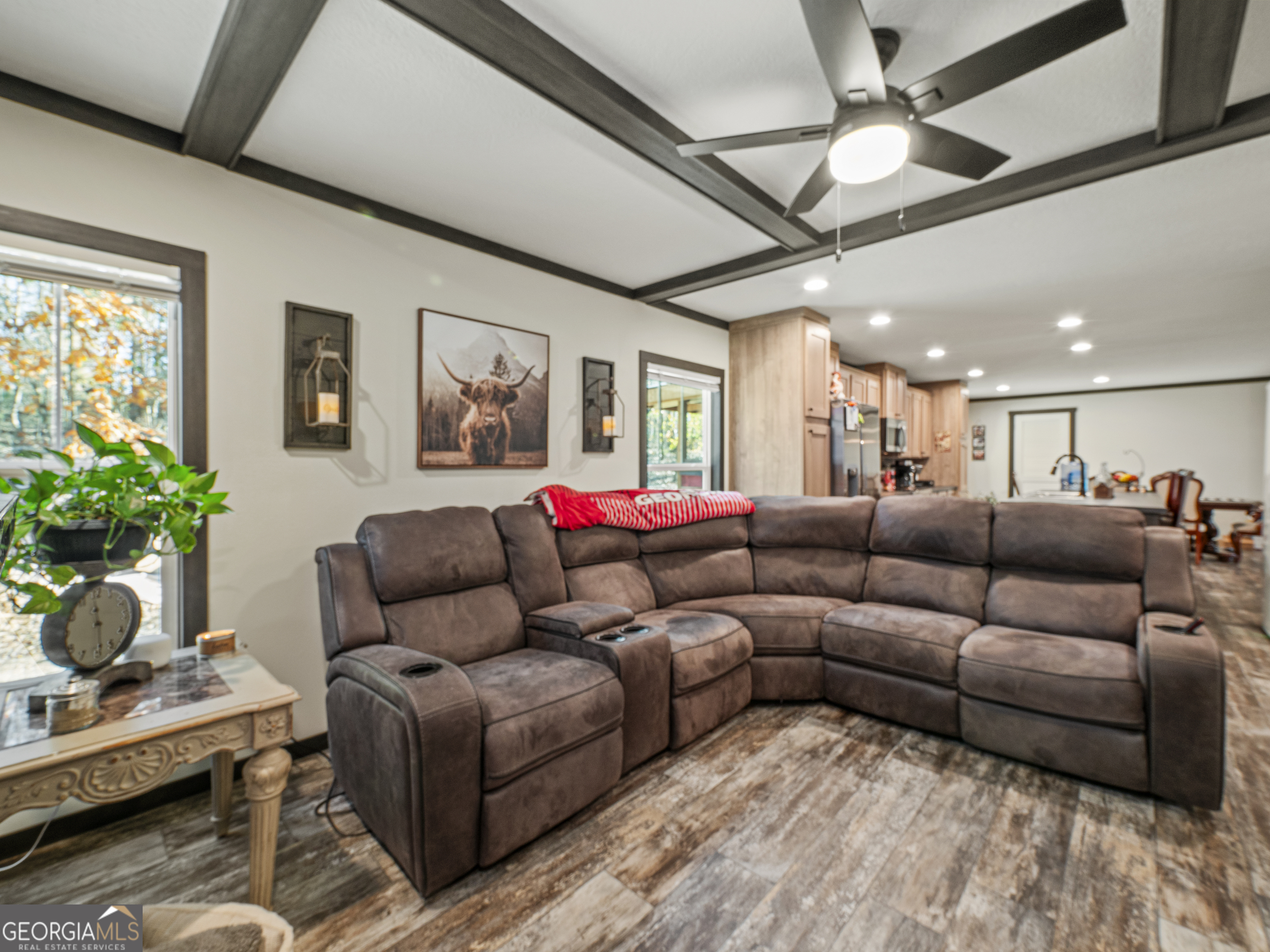 163 M M T Trail Commerce, GA 30530 - Photo 19 of 32 a living room with furniture kitchen view and a potted plant