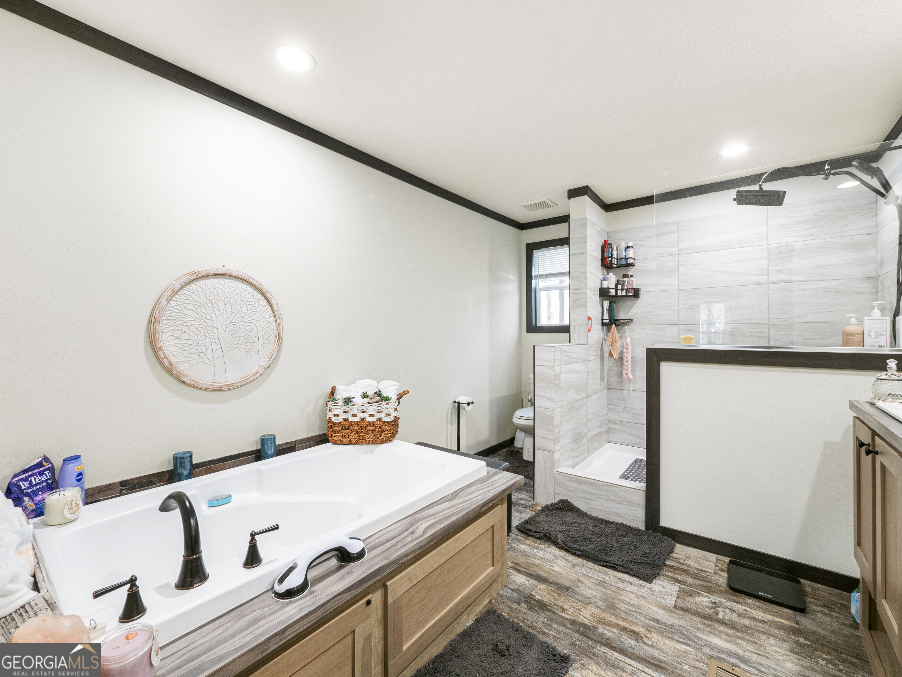 163 M M T Trail Commerce, GA 30530 - Photo 26 of 32 a bedroom with a bed and a mirror