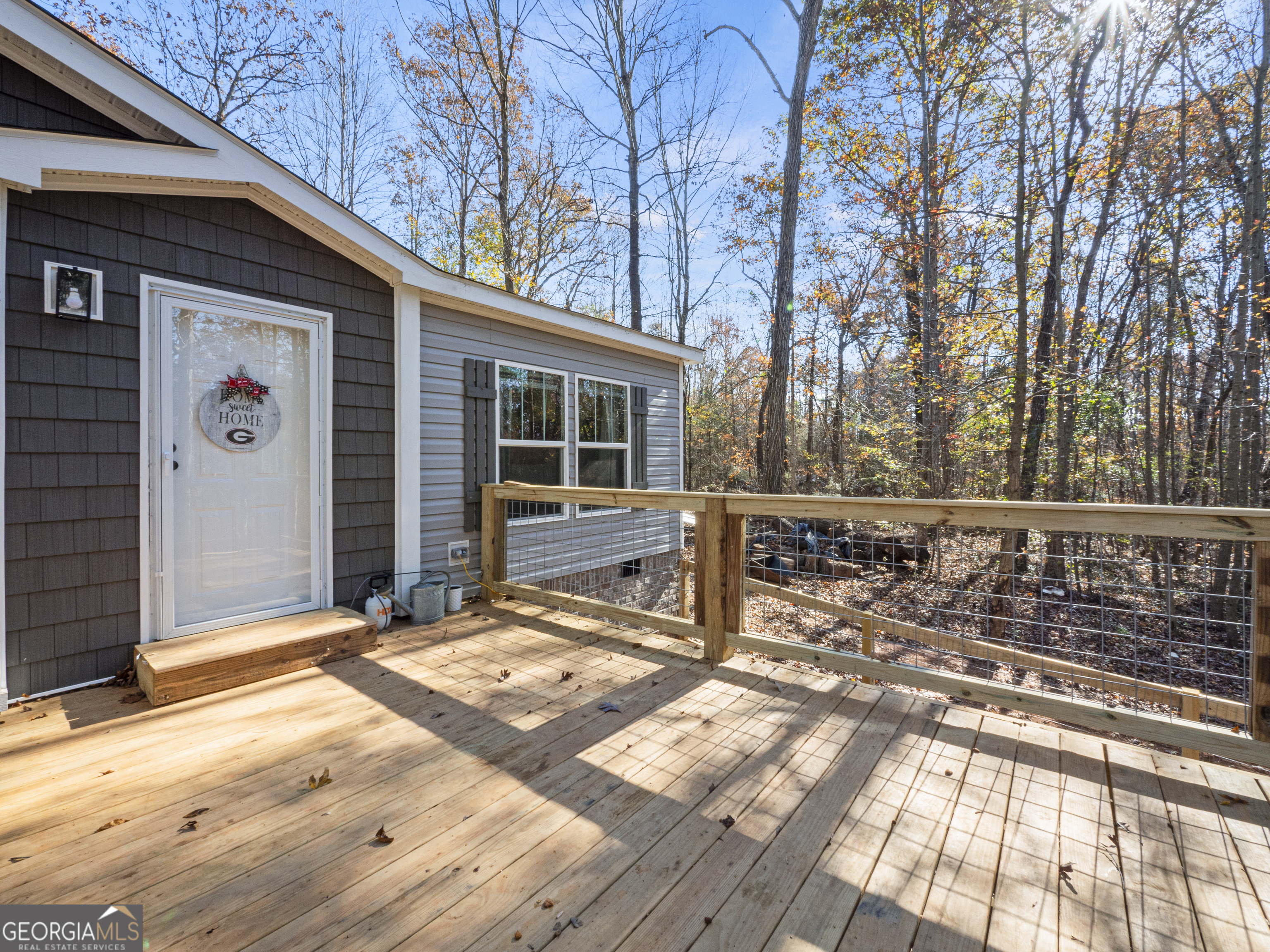 163 M M T Trail Commerce, GA 30530 - Photo 4 of 32 a front view of a house