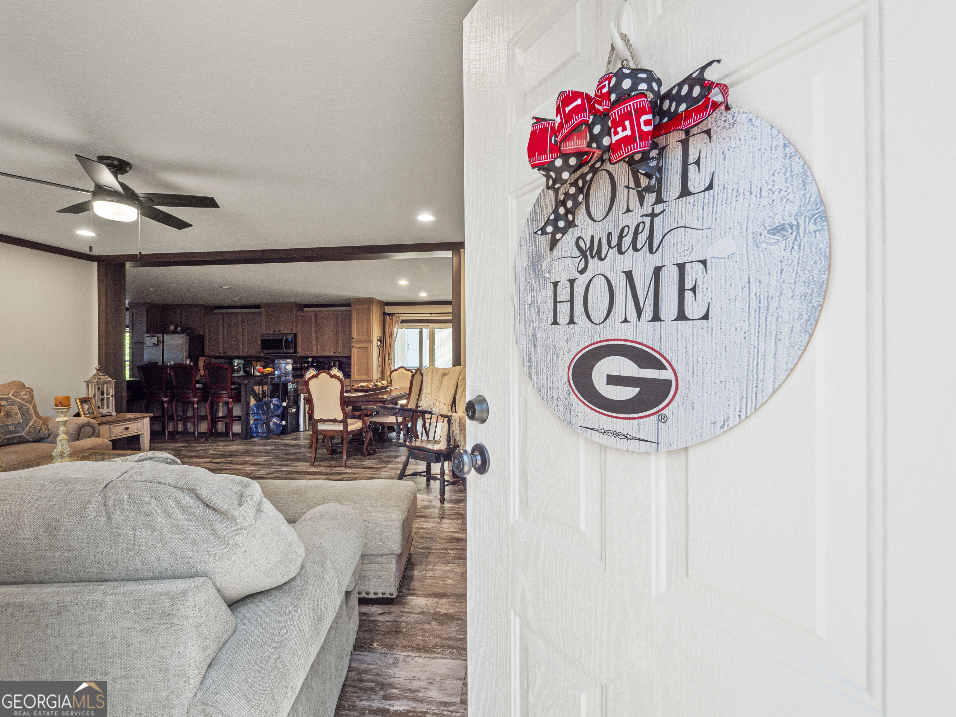 163 M M T Trail Commerce, GA 30530 - Photo 5 of 32 a living room with furniture and a chandelier