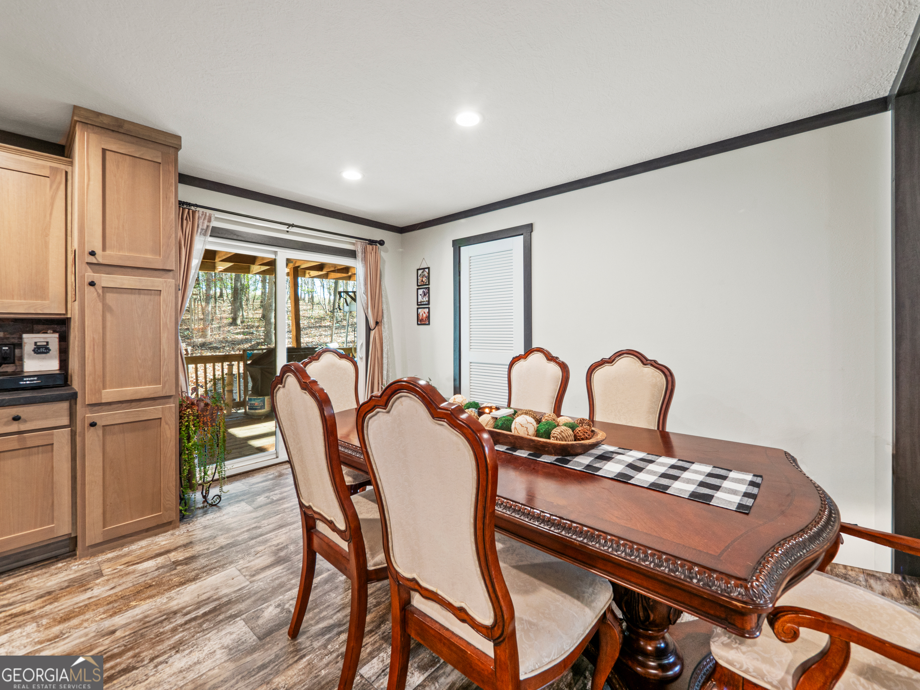 163 M M T Trail Commerce, GA 30530 - Photo 10 of 32 a view of a dining room with furniture a chandelier and wooden floor