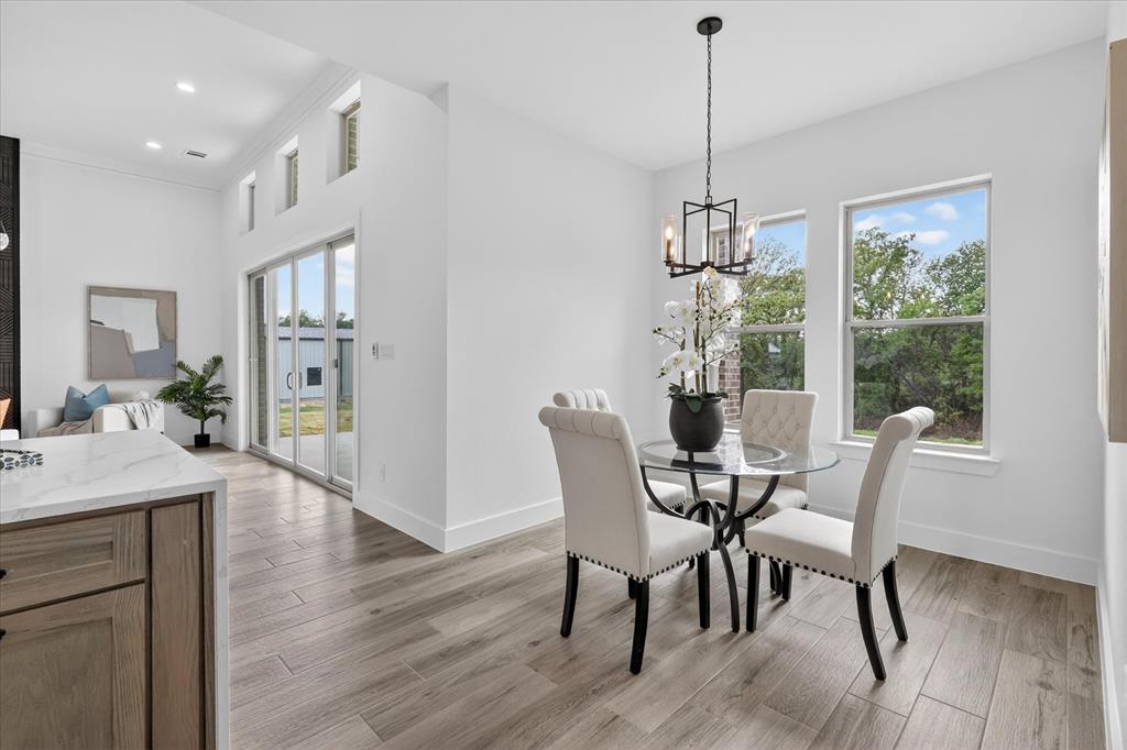 182 Briar Patch Azle, TX 76020 - Photo 13 of 36 Dining area with light wood-style floors and a chandelier