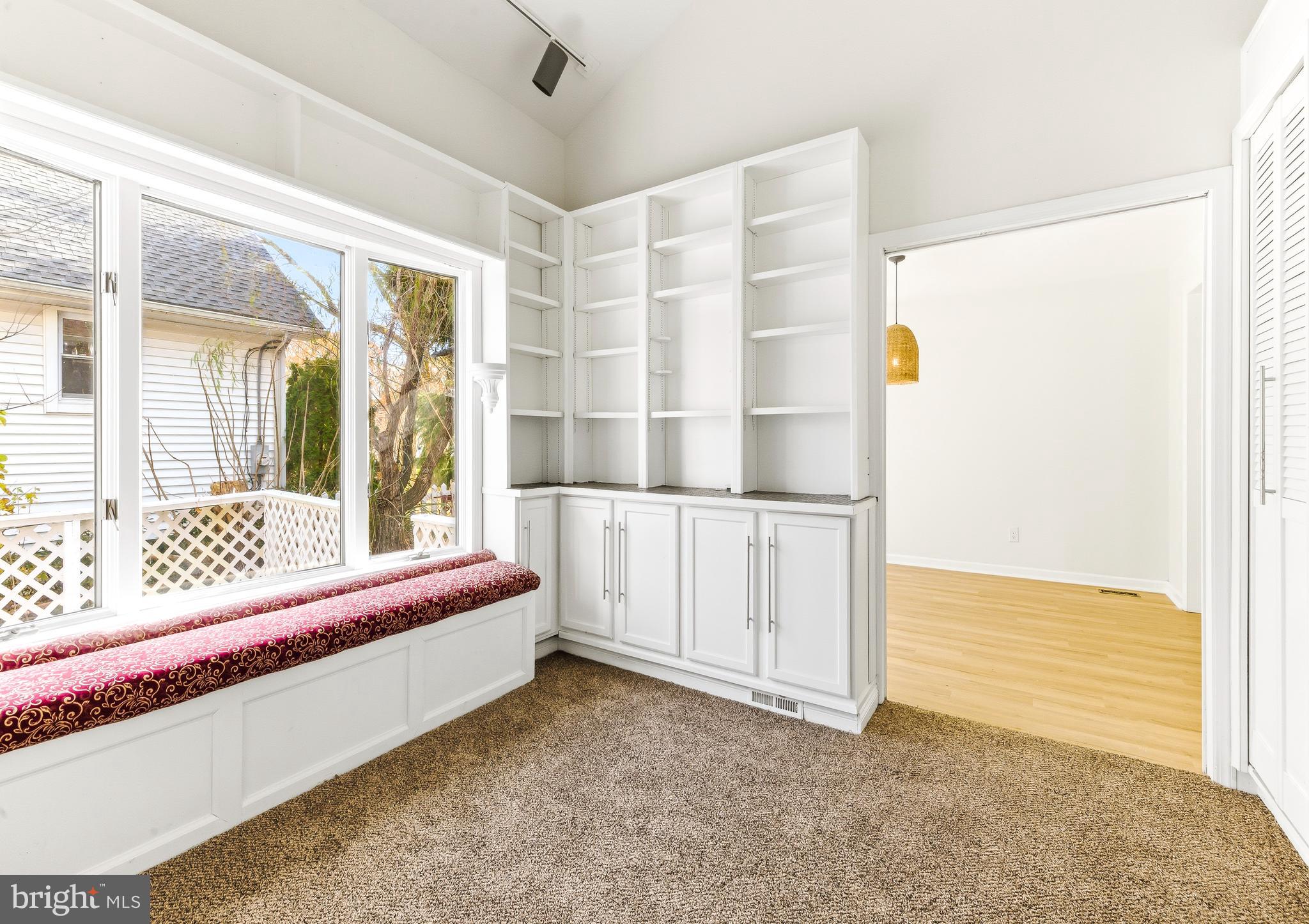 110 East Seaview Avenue Linwood, NJ 08221 - Photo 17 of 48 a living room with a bed and next to a window