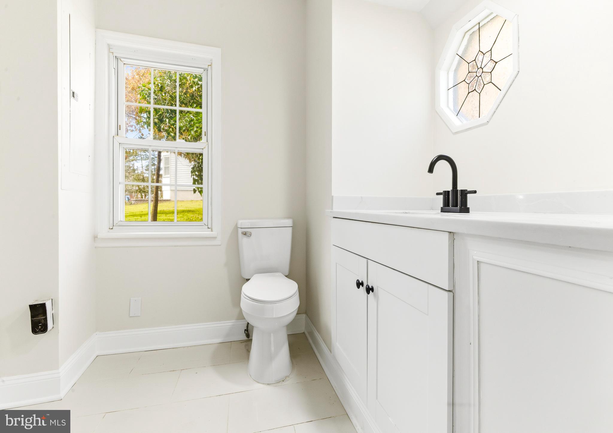 110 East Seaview Avenue Linwood, NJ 08221 - Photo 24 of 48 a bathroom with a sink and a toilet