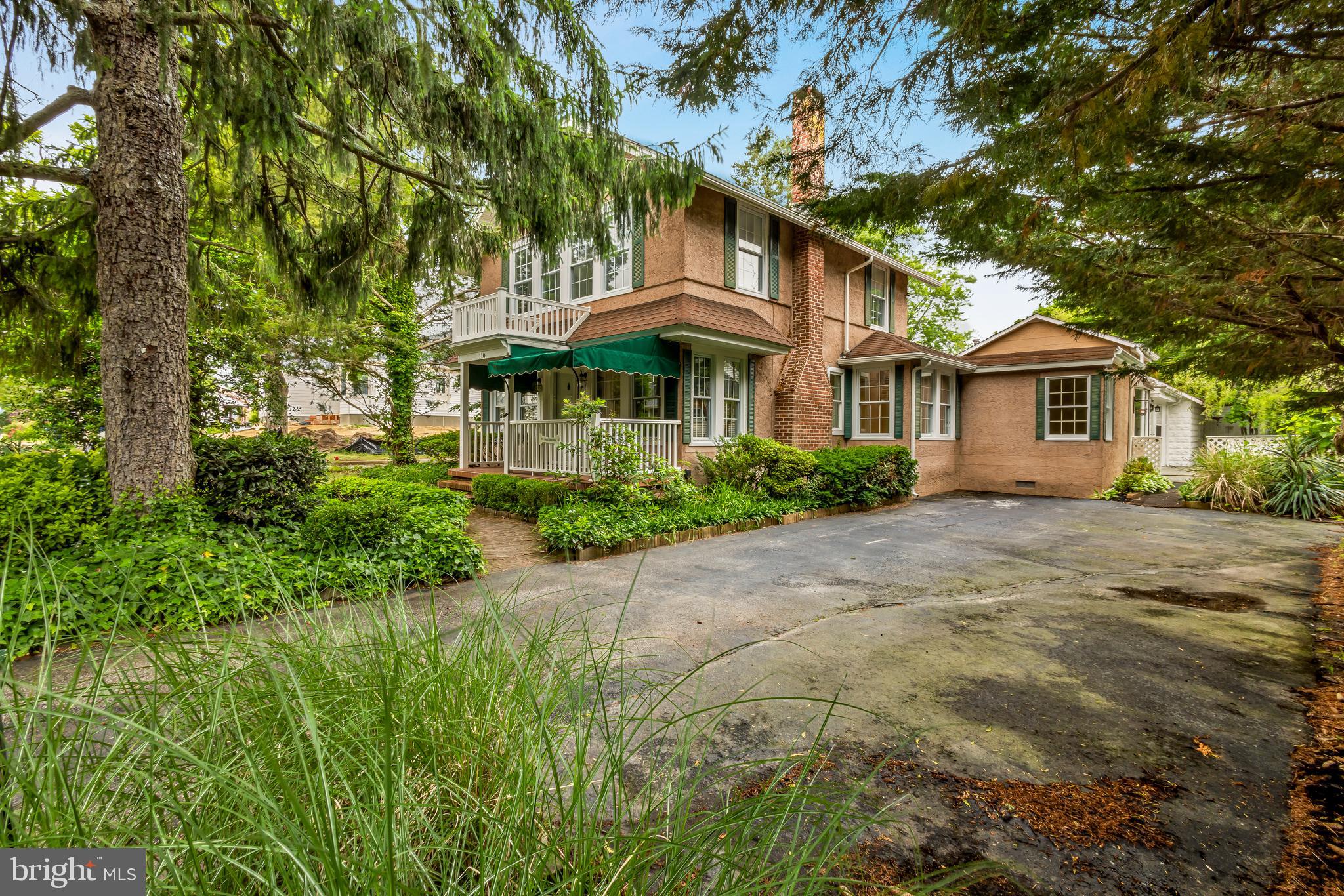 110 East Seaview Avenue Linwood, NJ 08221 - Photo 3 of 48 a yellow house with trees in front of it