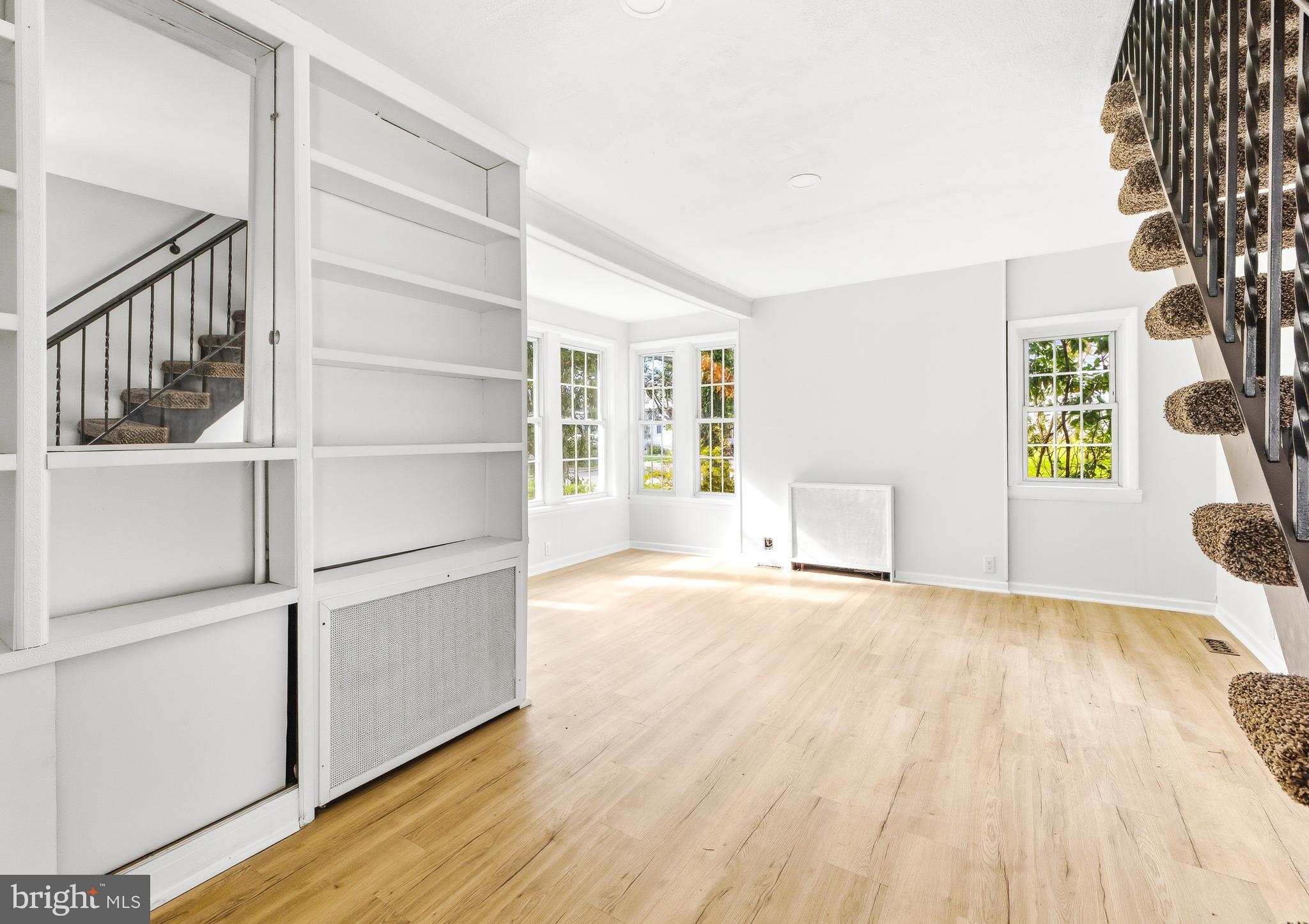 110 East Seaview Avenue Linwood, NJ 08221 - Photo 6 of 48 a view of an empty room with a window and wooden floor