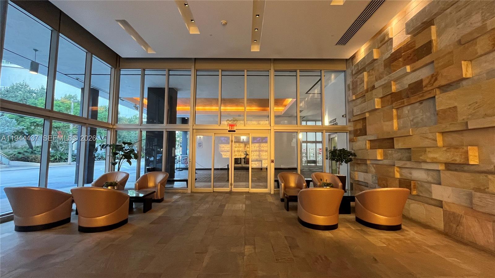 55 Southeast 6th Street, Unit 2601 Miami, FL 33131 - Photo 29 of 46 a room with gym equipment