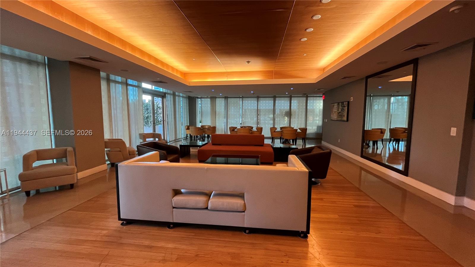 55 Southeast 6th Street, Unit 2601 Miami, FL 33131 - Photo 31 of 46 a living room with furniture and a wooden floor