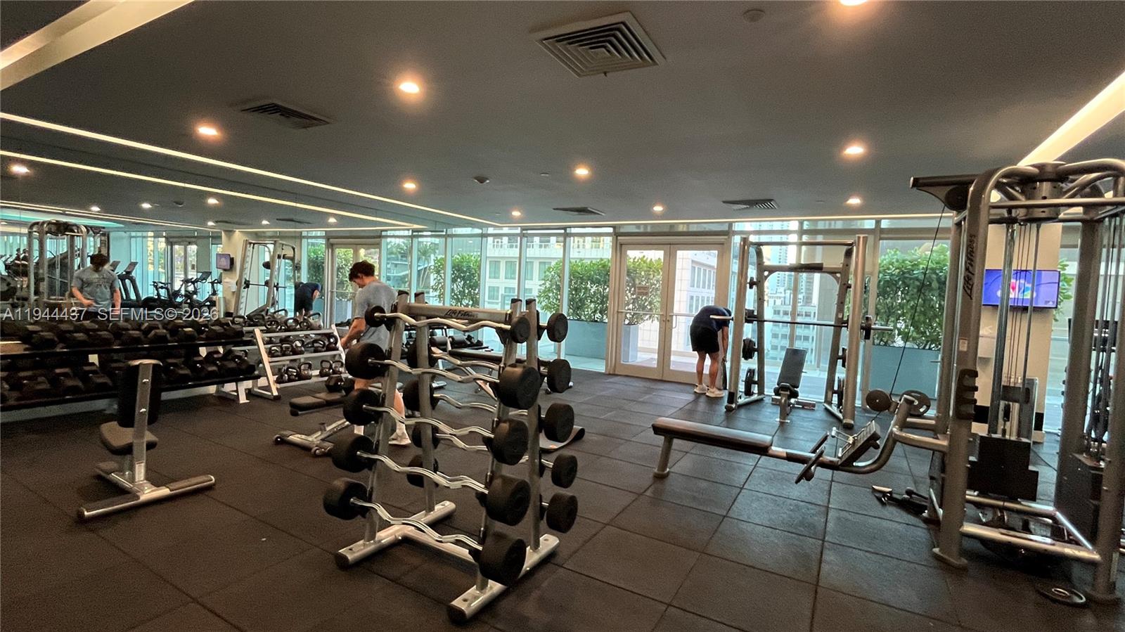 55 Southeast 6th Street, Unit 2601 Miami, FL 33131 - Photo 40 of 46 a view of a room with gym equipment