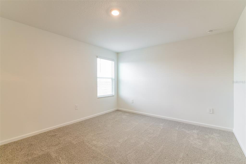 4009 Old Ml Road Haines City, FL 33844 - Photo 11 of 24 an empty room with a window