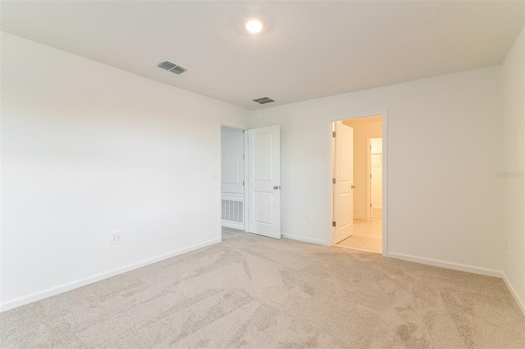 4009 Old Ml Road Haines City, FL 33844 - Photo 6 of 24 an empty room with a empty space and windows