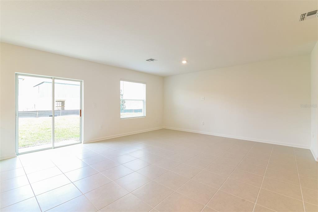 4009 Old Ml Road Haines City, FL 33844 - Photo 10 of 24 an empty room with windows