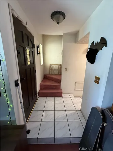 a view of a backyard patio and fire pit