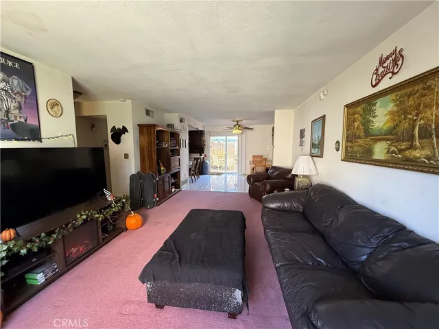 a view of a tables and chairs under an umbrella