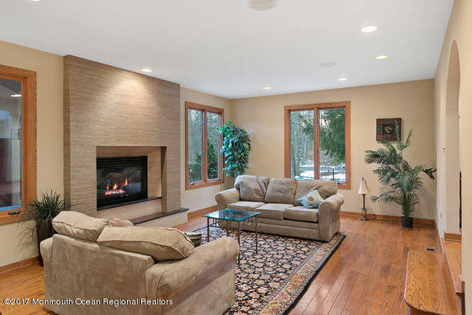 1644 Martin Road Neptune, NJ 07753 - Photo 11 of 42 a living room with furniture and a fireplace