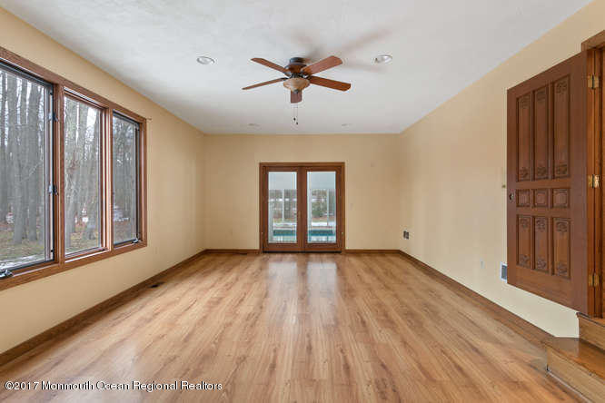 1644 Martin Road Neptune, NJ 07753 - Photo 16 of 42 a view of an empty room with a window and wooden floor