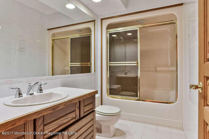 1644 Martin Road Neptune, NJ 07753 - Photo 17 of 42 a bathroom with a sink toilet and shower