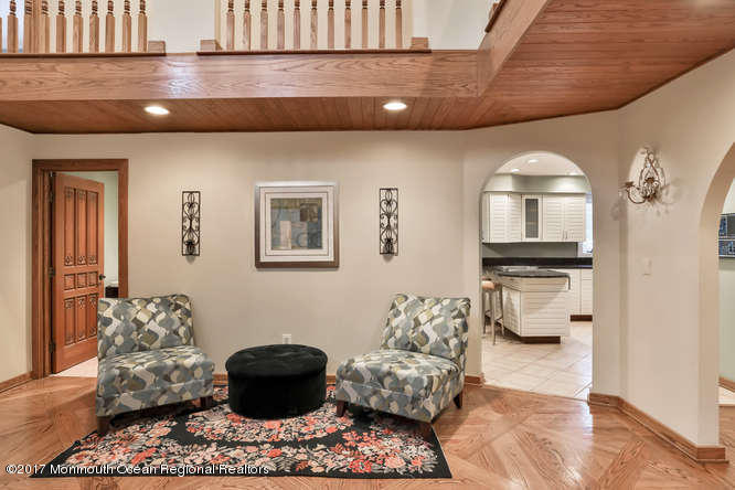 1644 Martin Road Neptune, NJ 07753 - Photo 21 of 42 a living room with furniture and a chandelier