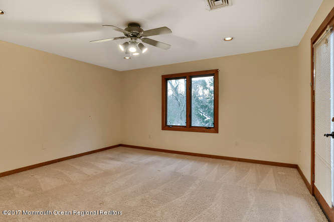 1644 Martin Road Neptune, NJ 07753 - Photo 27 of 42 an empty room with windows and fan