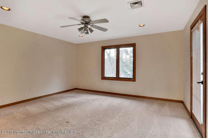 1644 Martin Road Neptune, NJ 07753 - Photo 29 of 42 an empty room with windows and fan