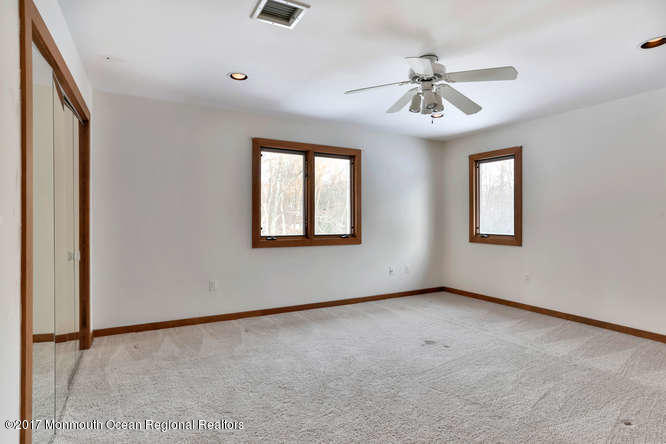1644 Martin Road Neptune, NJ 07753 - Photo 31 of 42 an empty room with windows and fan