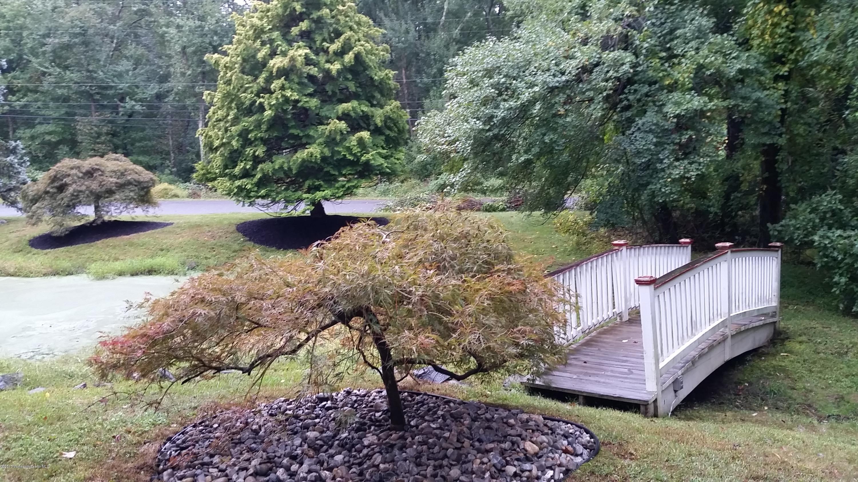 1644 Martin Road Neptune, NJ 07753 - Photo 38 of 42 a view of a wooden house with a yard and sitting area