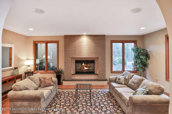 1644 Martin Road Neptune, NJ 07753 - Photo 10 of 42 a living room with furniture and a fireplace