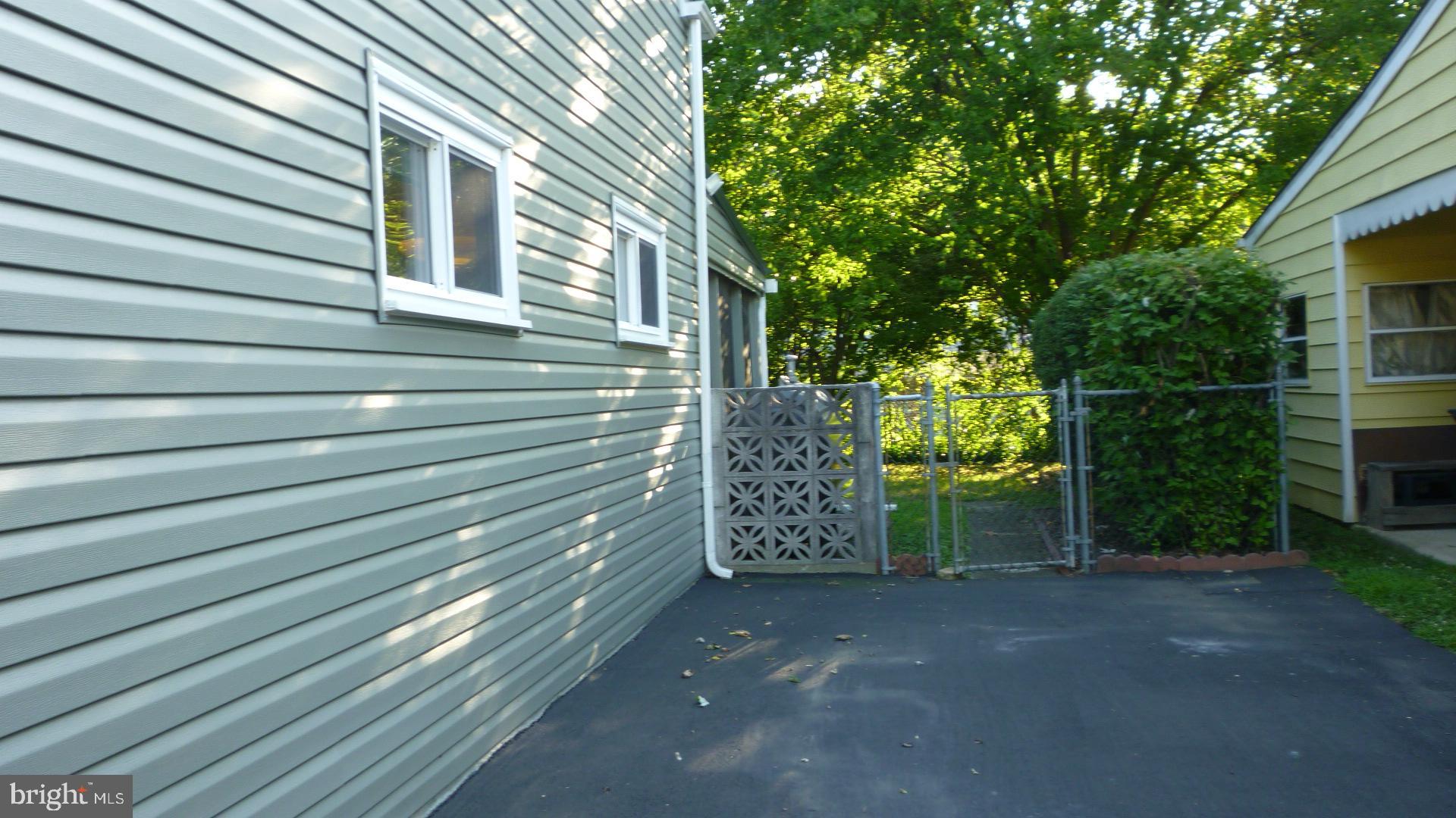 21 Merriman Road Newark, DE 19713 - Photo 39 of 44 Right driveway with gate to backyard, holds 2 cars