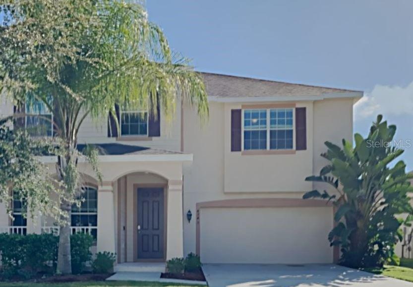 4345 Saltmarsh Sparrow Drive Windermere, FL 34786 - Photo 1 of 1 a front view of a house with a garden