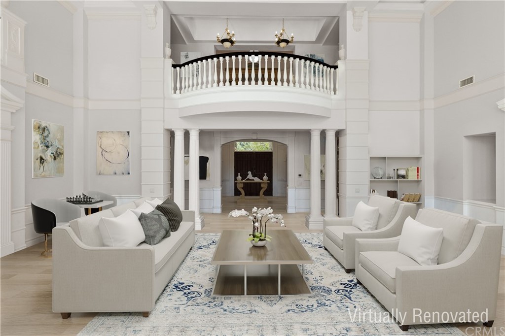 Living room - virtually renovated to show updated flooring, paint, furniture and decorative treatment.