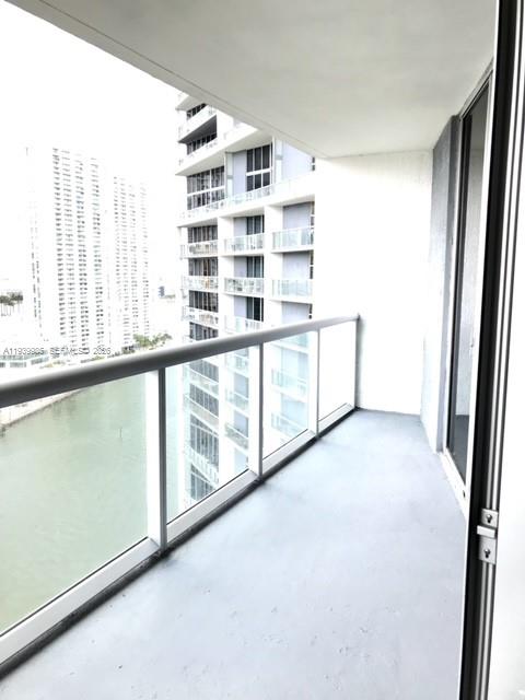 475 Brickell Avenue, Unit 2014 Miami, FL 33131 - Photo 10 of 14 a view of an empty room with windows