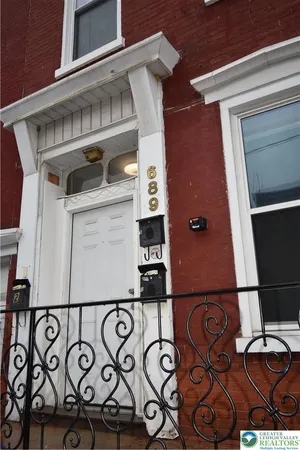 a front of a door with a mirror