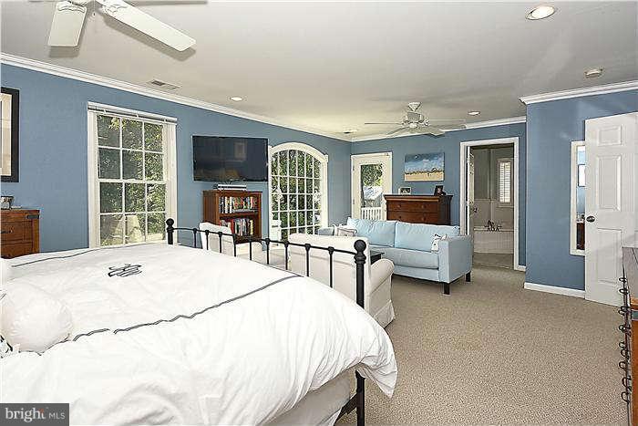 4904 South Chesterfield Road Arlington, VA 22206 - Photo 22 of 30 a bed room with a bed and a flat screen tv