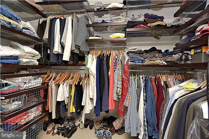 4904 South Chesterfield Road Arlington, VA 22206 - Photo 29 of 30 a view of walk in closet with clothes and shoes
