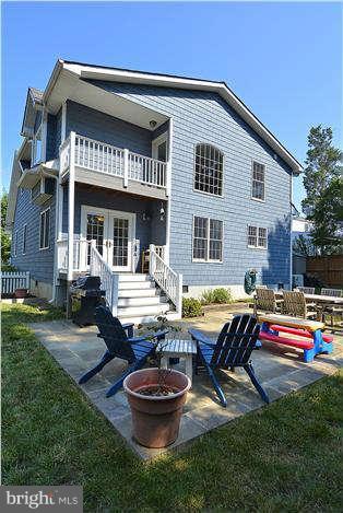 4904 South Chesterfield Road Arlington, VA 22206 - Photo 4 of 30 a view of a house with pool and chairs