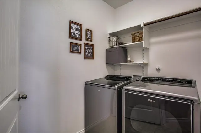 a utility room with washer and dryer