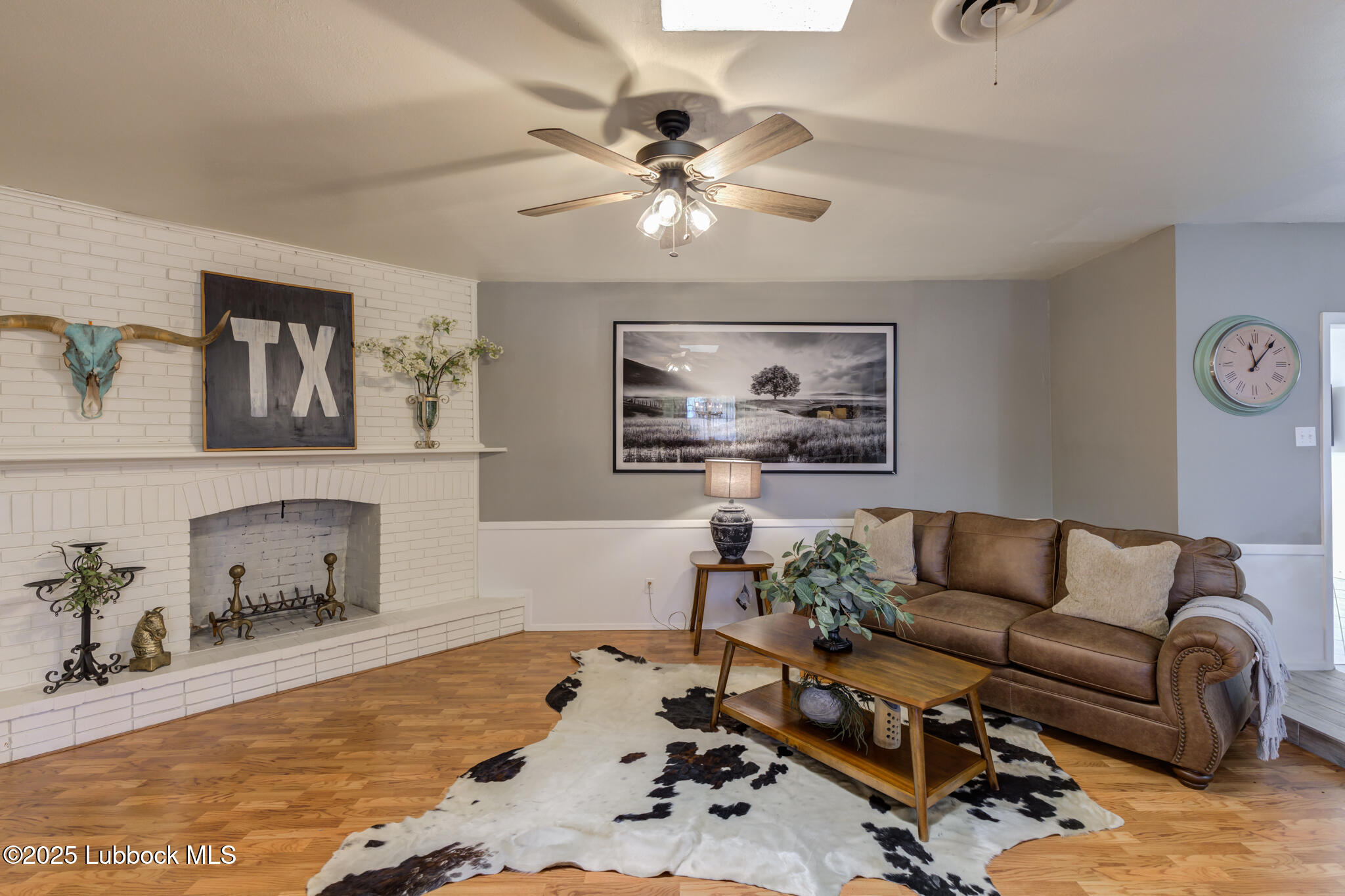 1205 Garland Plainview, TX 79072 - Photo 12 of 50 a living room with furniture and a chandelier