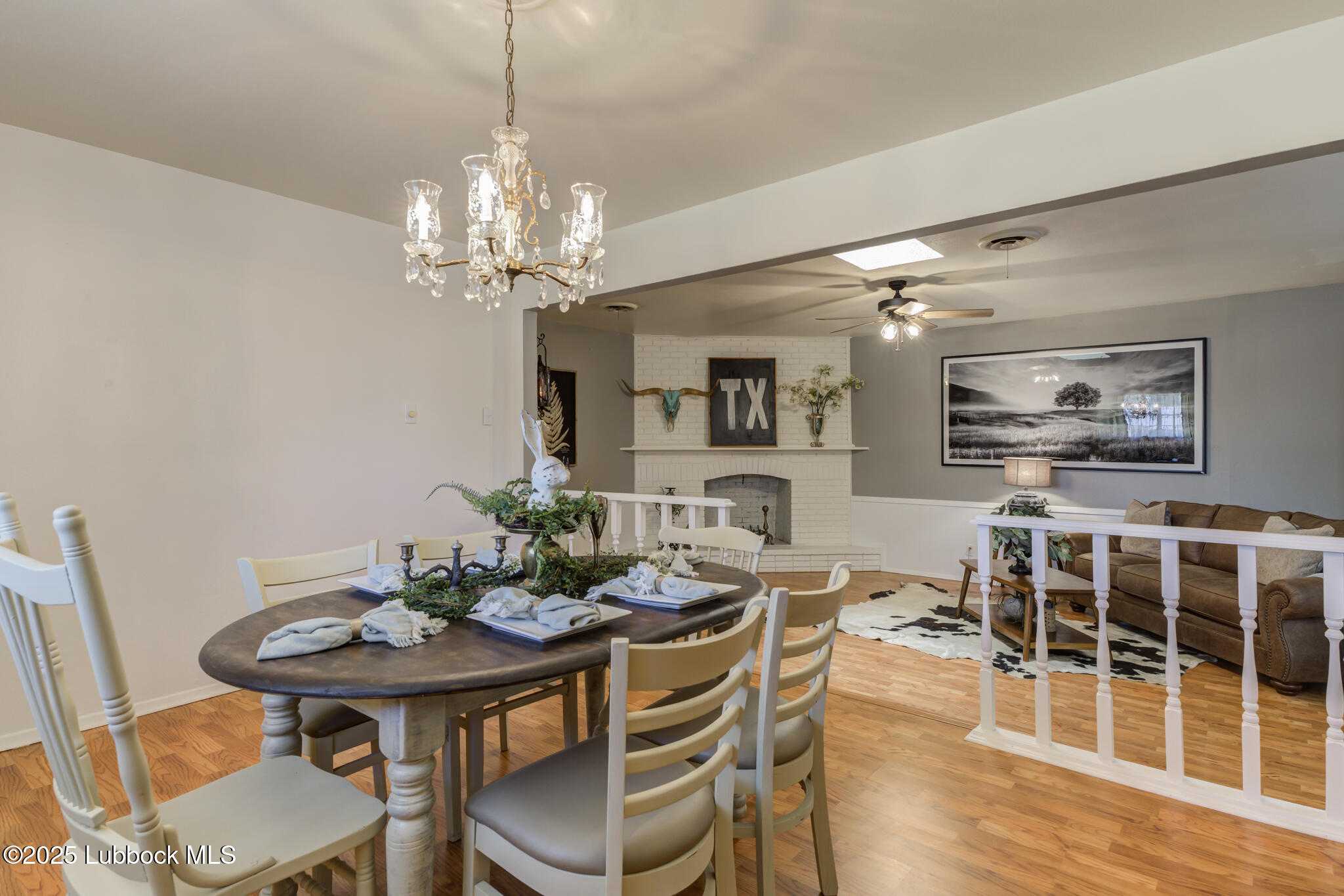 1205 Garland Plainview, TX 79072 - Photo 15 of 50 a view of a dining room with furniture wooden floor and chandelier