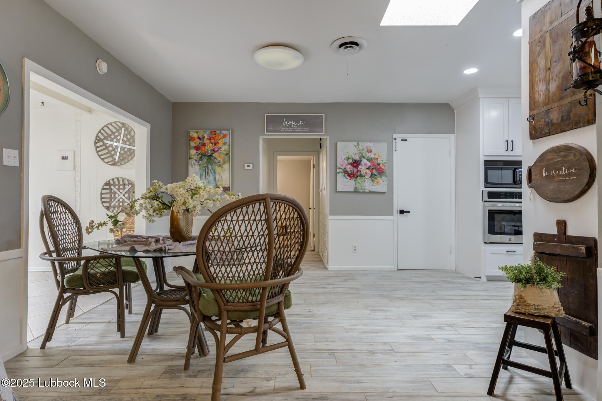 1205 Garland Plainview, TX 79072 - Photo 16 of 50 a view of a dining room with furniture and wooden floor