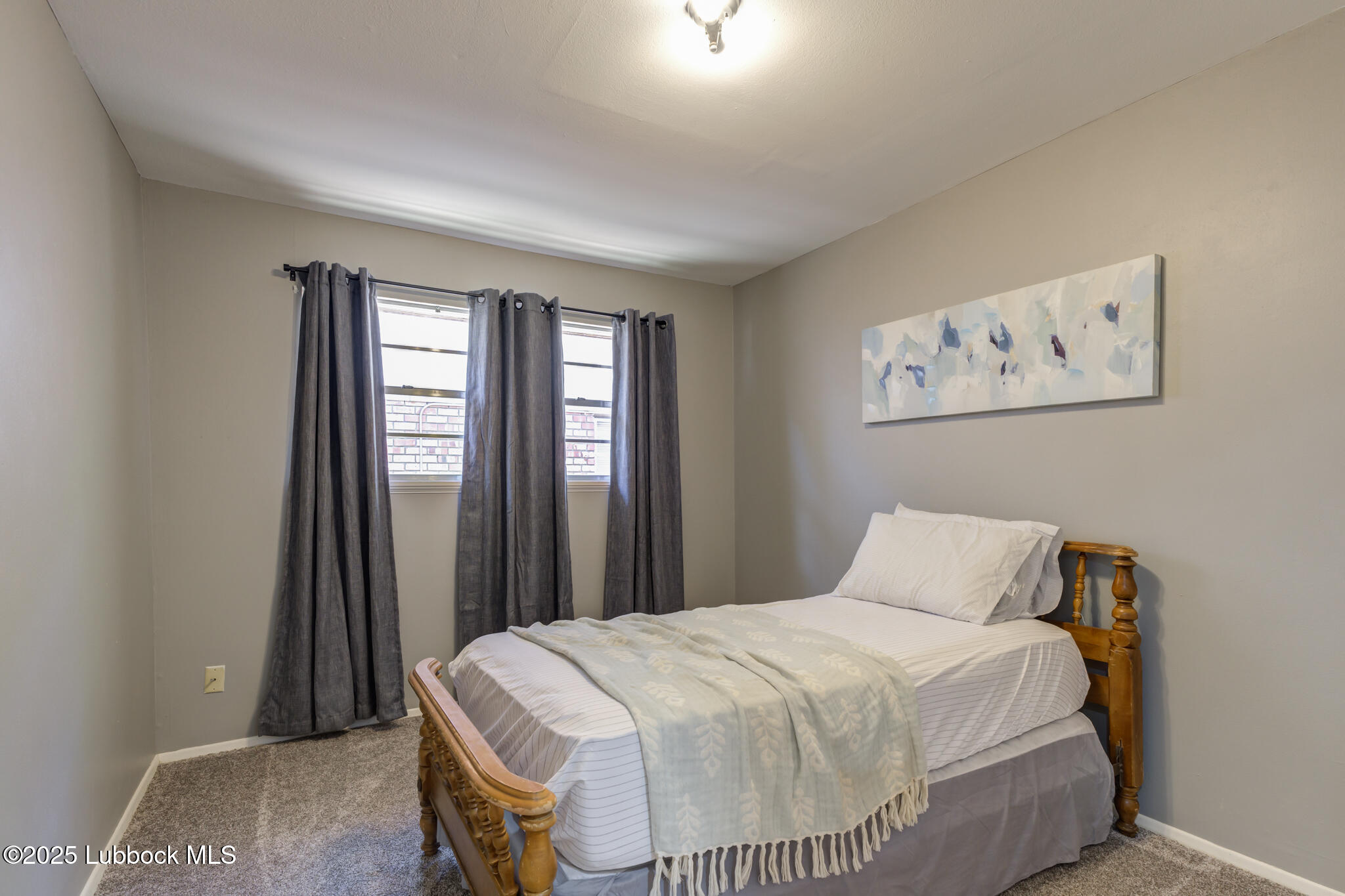 1205 Garland Plainview, TX 79072 - Photo 35 of 50 a bedroom with a bed and a window