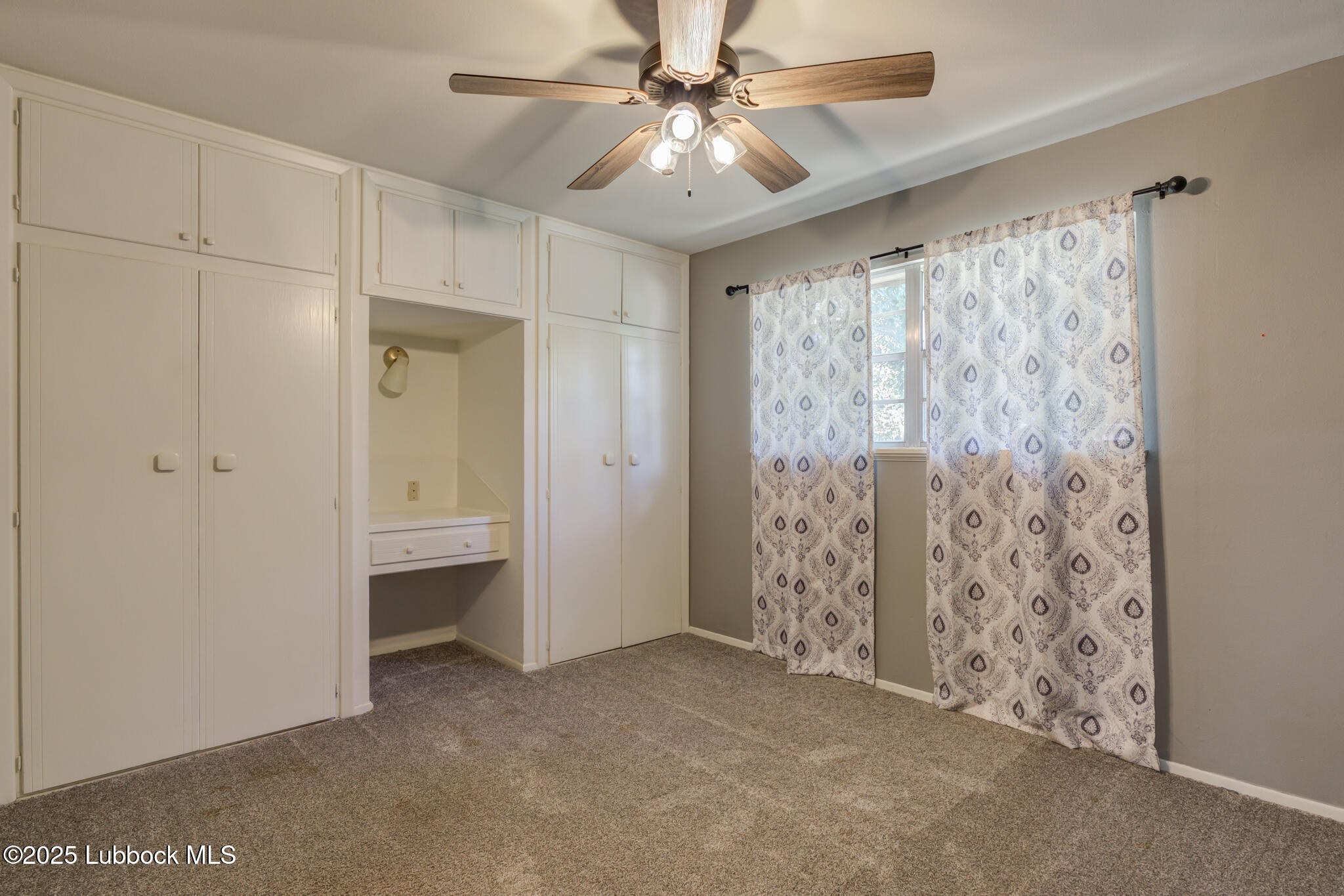 1205 Garland Plainview, TX 79072 - Photo 37 of 50 a view of empty room with window and ceiling fan