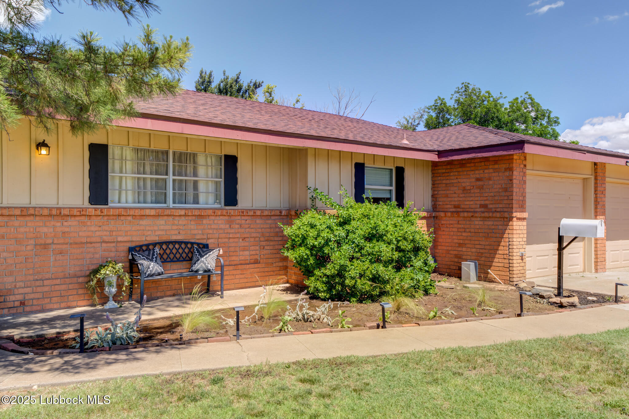 1205 Garland Plainview, TX 79072 - Photo 4 of 50 a front view of a house with garden