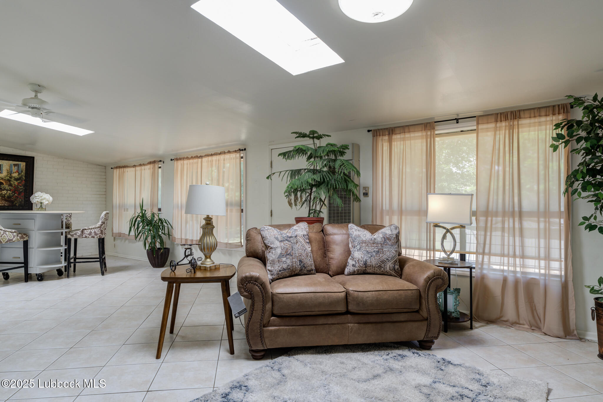 1205 Garland Plainview, TX 79072 - Photo 41 of 50 a living room with furniture and a potted plant