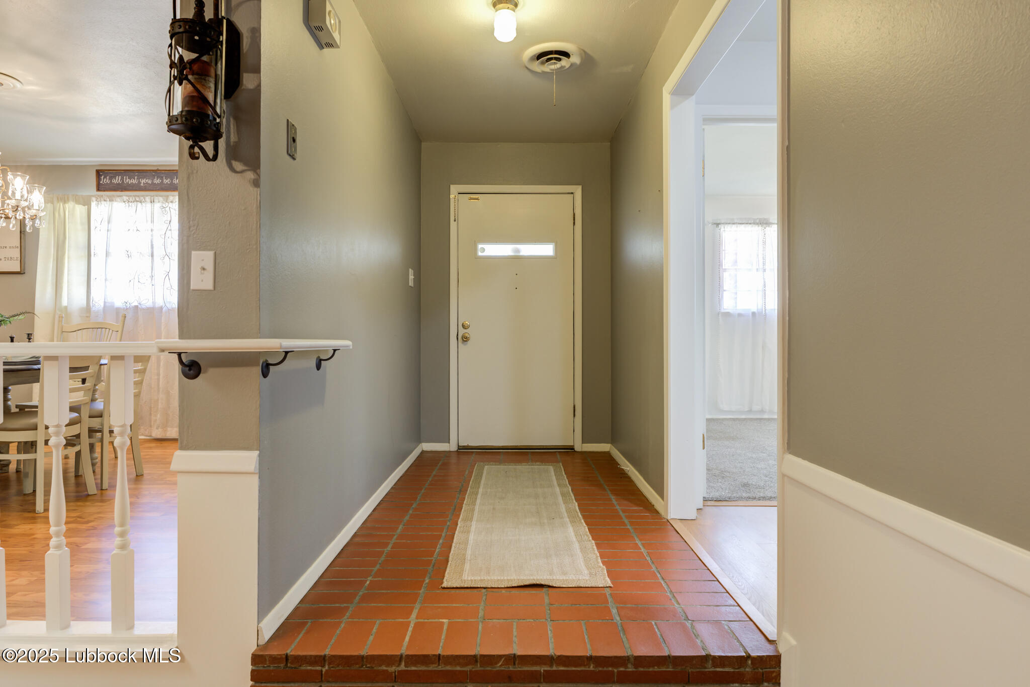 1205 Garland Plainview, TX 79072 - Photo 5 of 50 a view of a hallway with wooden floor and staircase