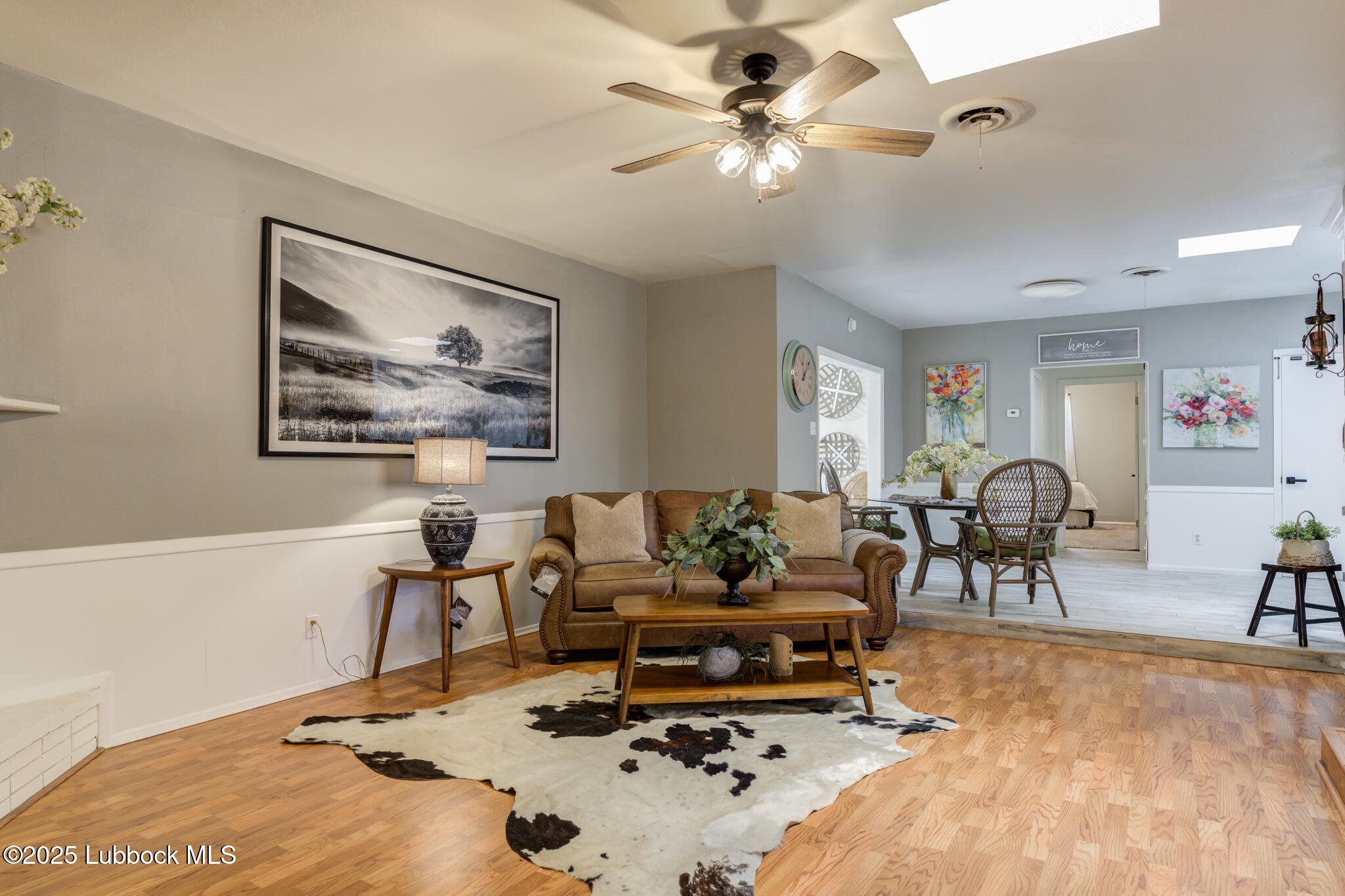 1205 Garland Plainview, TX 79072 - Photo 6 of 50 a living room with furniture and wooden floor