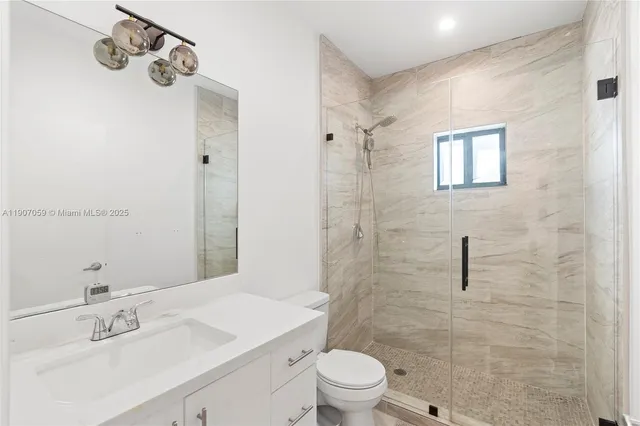 a view of a dining room with furniture and a flat screen tv