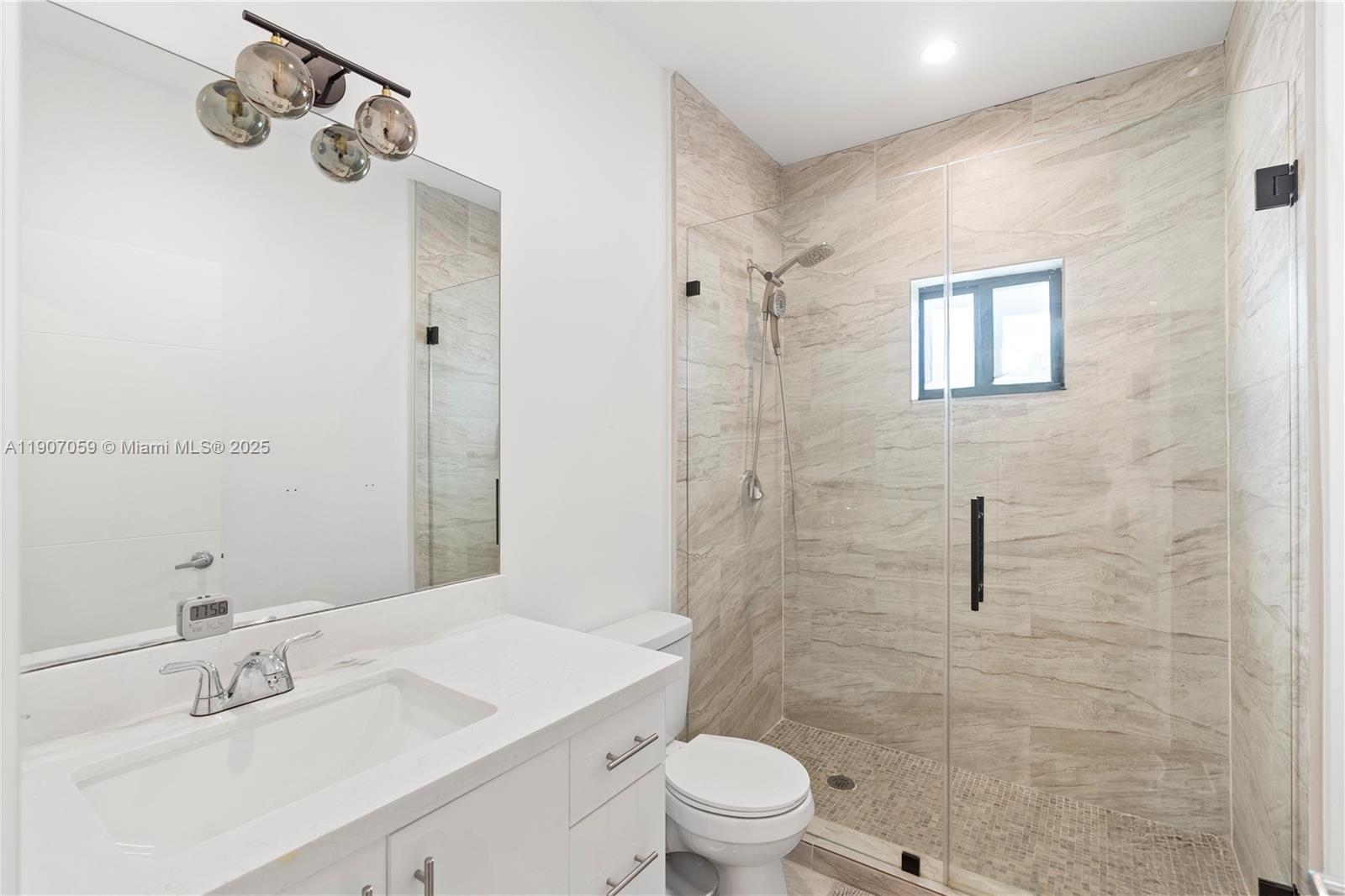 10925 Southwest 218th Terrace Miami, FL 33170 - Photo 11 of 32 a bathroom with a sink a toilet and shower