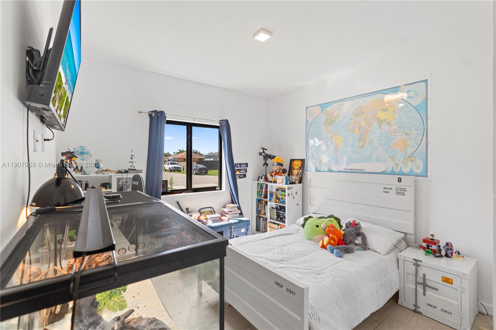 10925 Southwest 218th Terrace Miami, FL 33170 - Photo 12 of 32 a view of a dining room with furniture and a flat screen tv